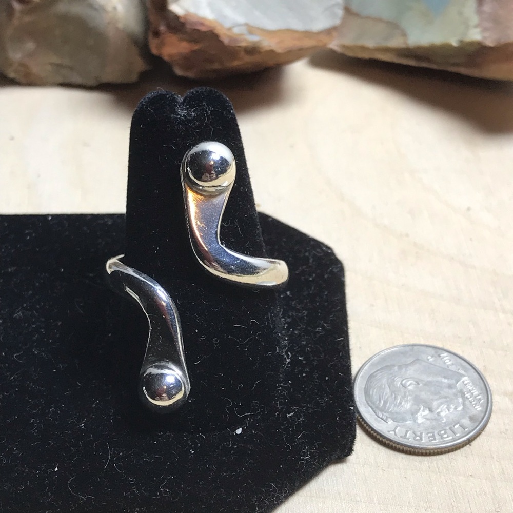 Sterling native bypass ring. About a 9